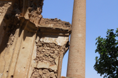 Spain, Belchite, S. Augustin Church, back of church view of chimney sulphur factory